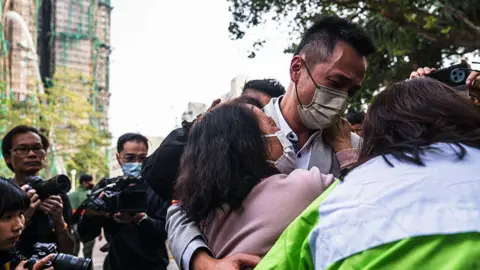 Heartbreak and Hope: Families Await News Amid Hong Kong Fire Tragedy