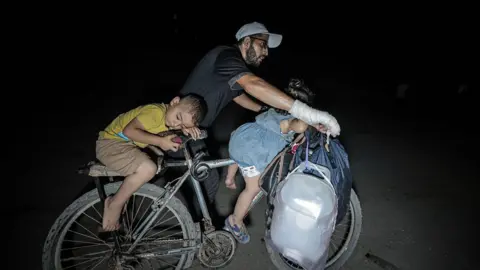 Urgent Exodus: Civilians Flee Gaza Amid Escalating Assault