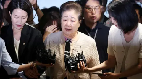 Unification Church Leader Faces Allegations of Bribery but Denies Wrongdoing