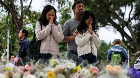 Community Grieves as Hong Kong Fire Claims 146 Lives