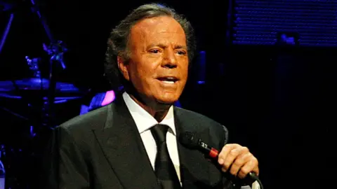 Julio Iglesias Responds to Sexual Assault Allegations with Denial